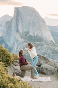 Proposal at Glacier Point in Yosemite during Sunrise with two women in hiking attire
