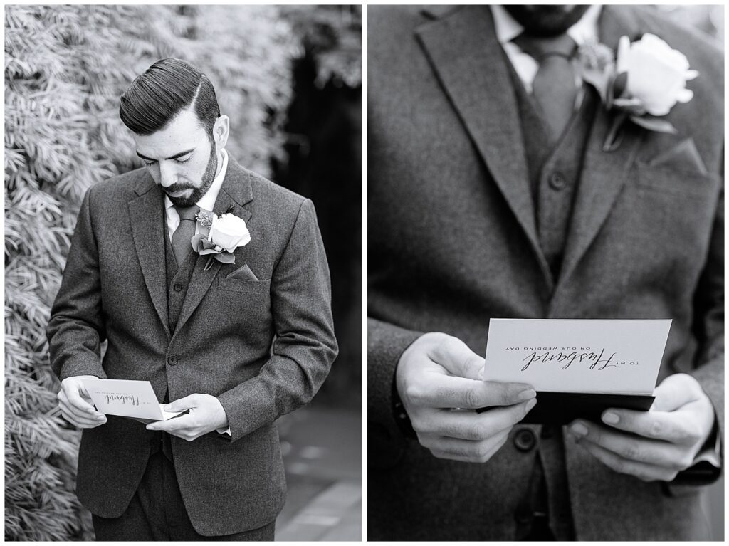 Black and white photo of a well dressed groom readying a letter from his bride just before she walks down the aisle.