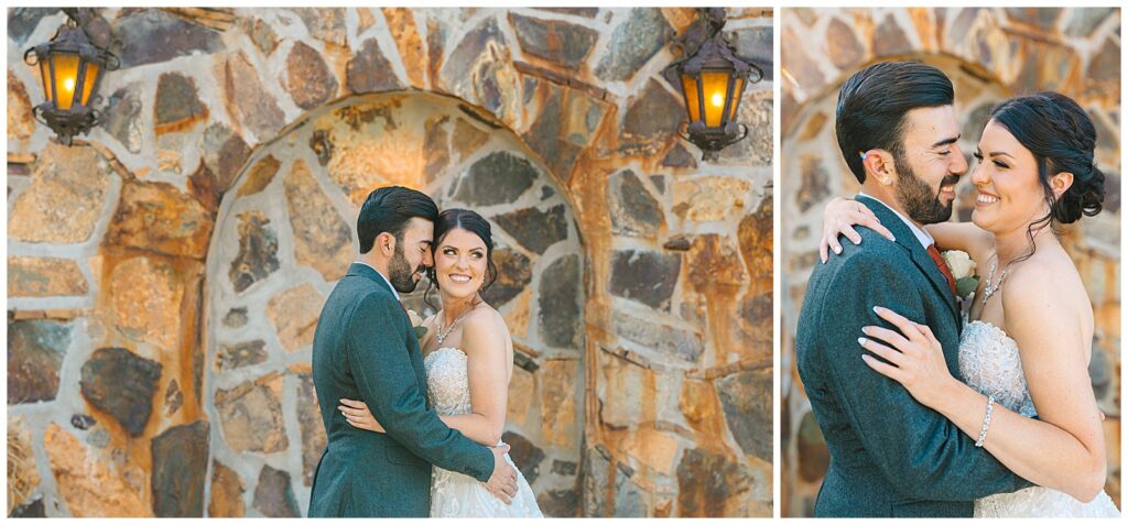 couple snuggling and smiling in bridal attire in front of a brick wall with glowing lights