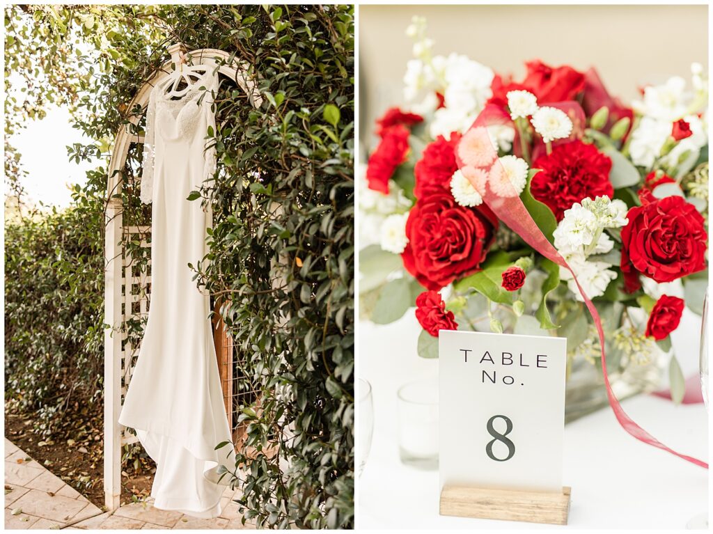 wedding dress hanging in archway with greenery around it and red garden rose centerpiece
