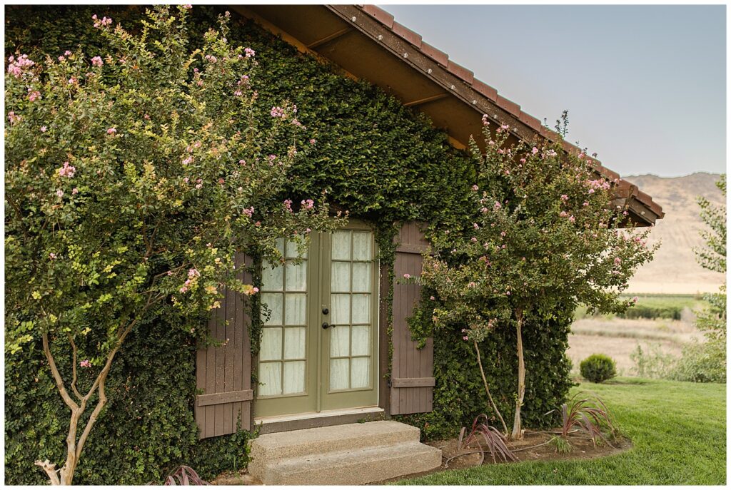 Door covered in vines at hidden hollow wedding venue