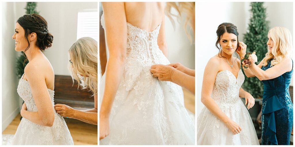 brides mom buttoning up the back of her wedding dress with the sunlight glowing through the window as the bride waits in eager anticaption